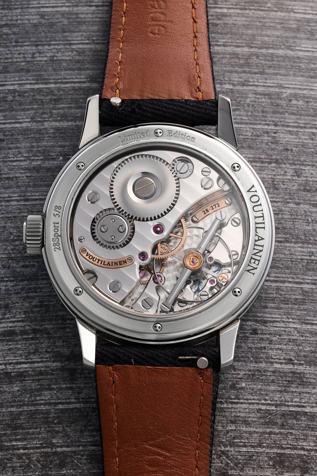 Detail of the Voutilainen 28Sport dial with blue guilloche and onyx.