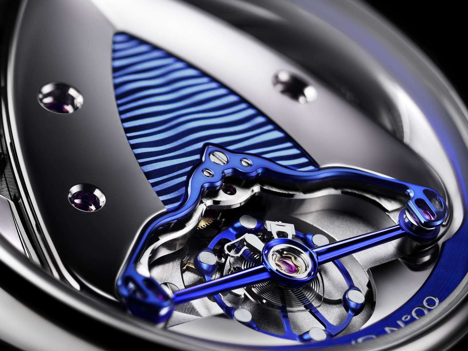 Macro of the blued titanium balance and polished bridge of the DB25 Digitale's DB2144V3 movement