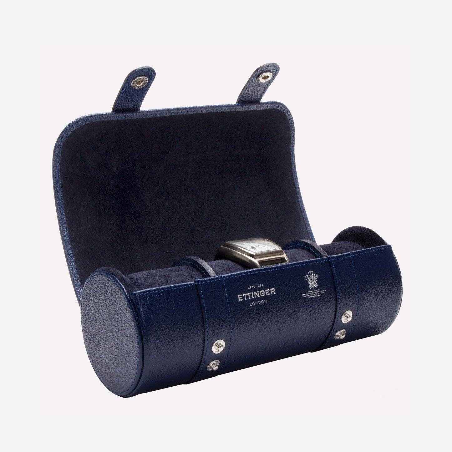 Open marine blue Ettinger triple watch roll with suede interior and watch cushions
