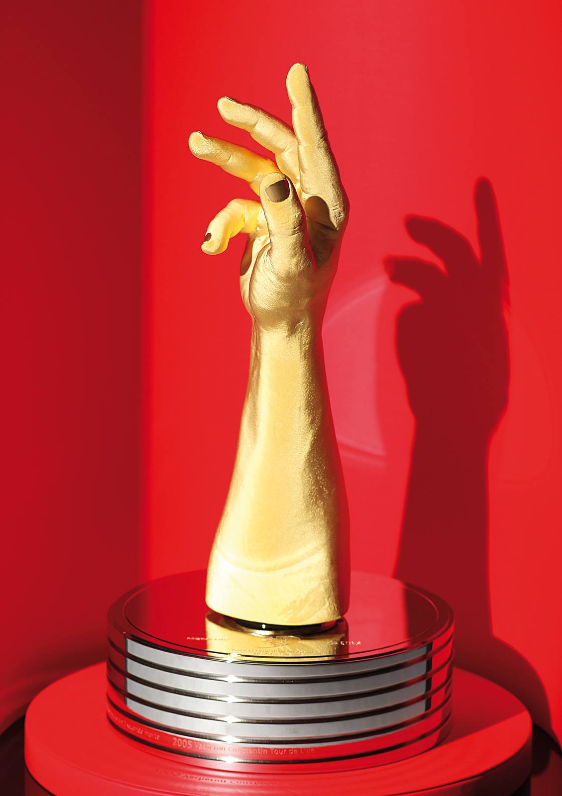 The golden hand trophy of the Grand Prix d'Horlogerie de Geneve.