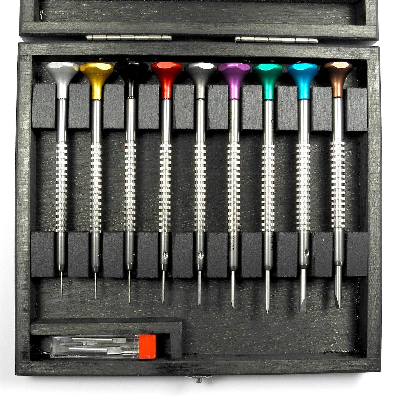 Overhead view of nine Horotec screwdrivers with colour-coded heads and spare blades