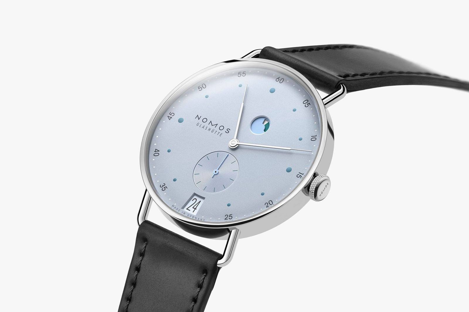 NOMOS Metro date power reserve ice blue at an angle showing wire lugs and slim case.