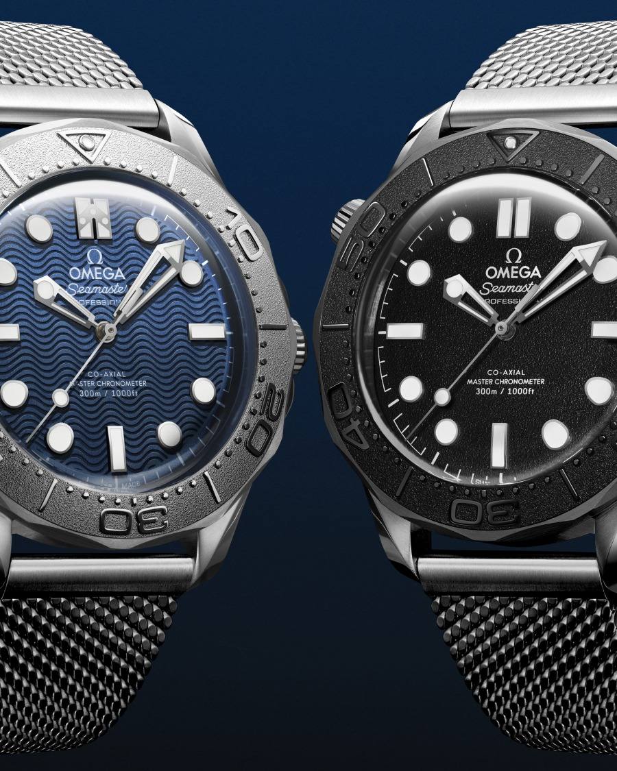 Close-up of the James Bond and Spectre Seamaster Diver 300M dials side by side.
