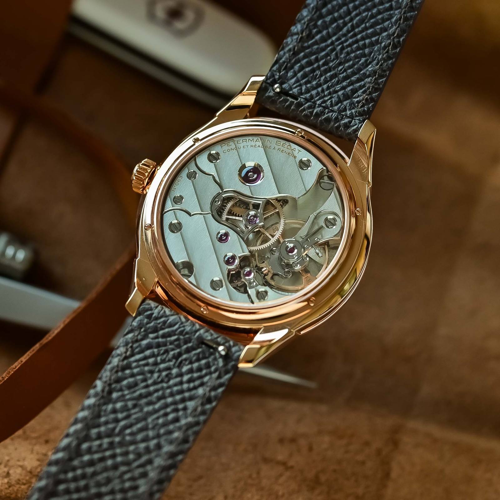 Caseback view of the Petermann Bedat Reference 1825 in rose gold showing the hand-wound calibre 233 movement