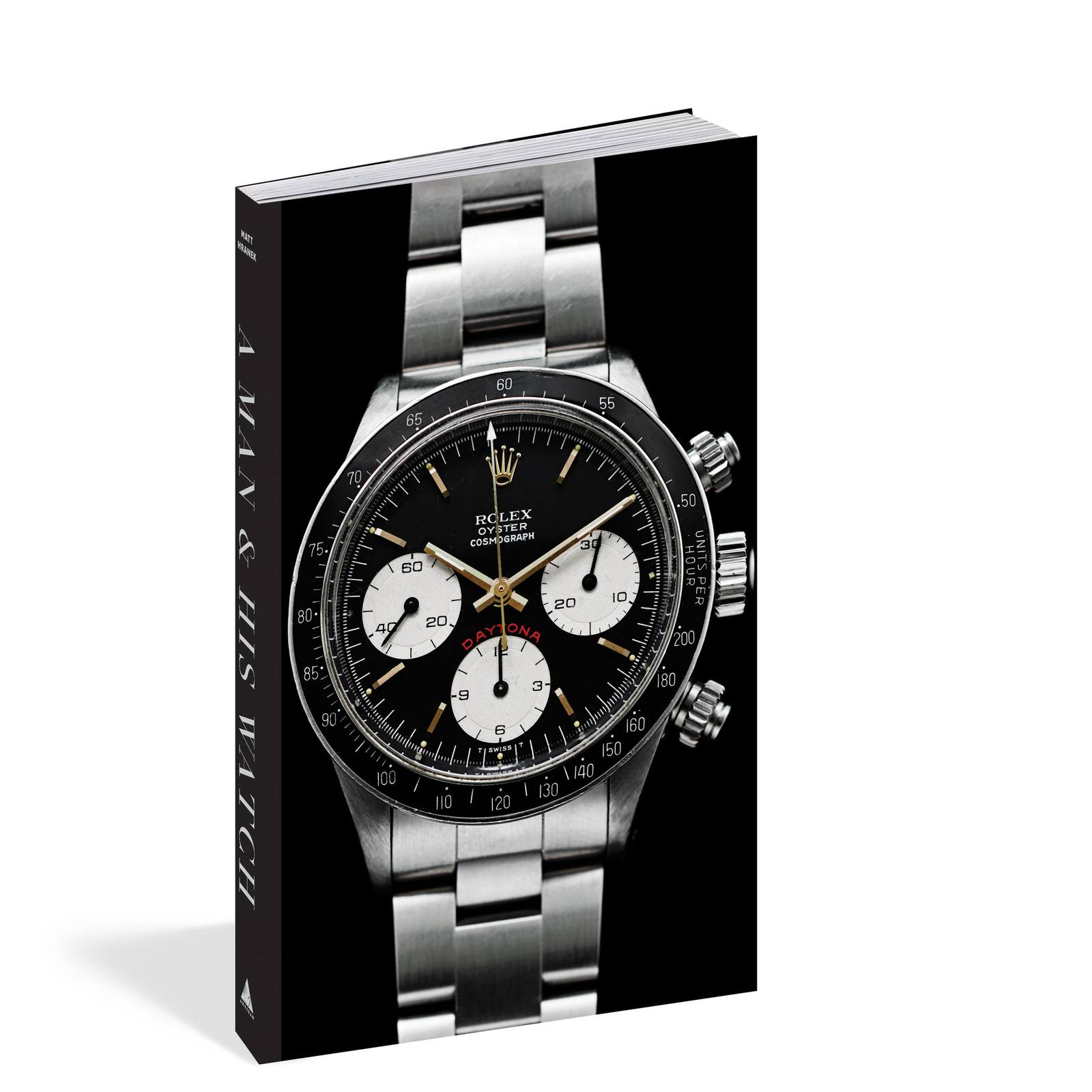 A Man and His Watch book with dust jacket peeling back to reveal a Rolex Daytona cover photo
