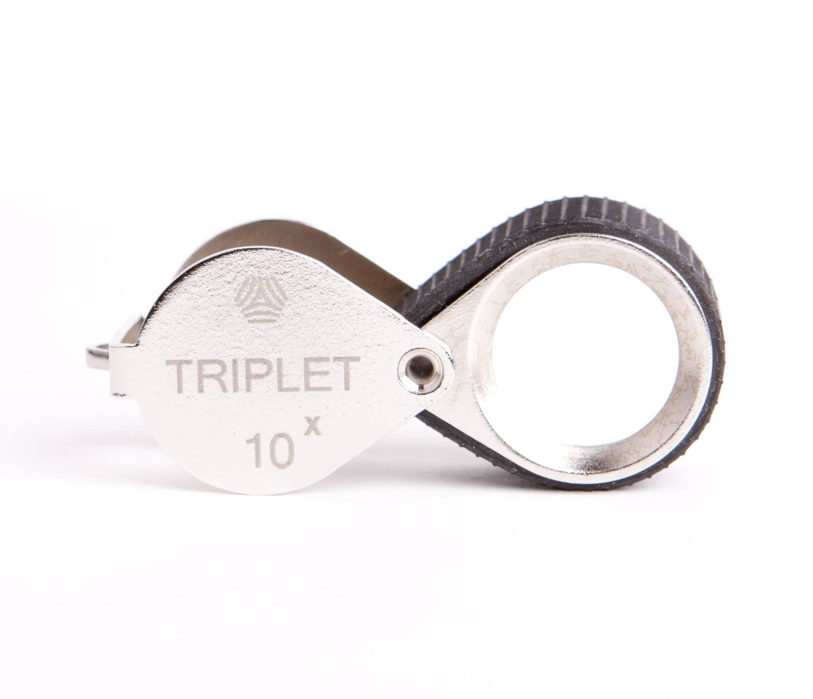BelOMO 10x triplet loupe folded closed, showing the engraved steel cover