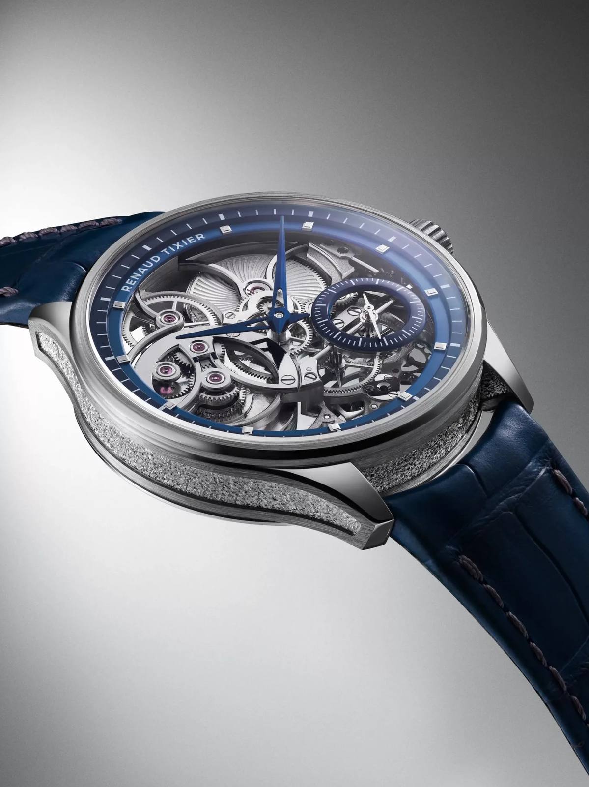Renaud Tixier Monday Skeleton petrol blue edition in profile showing chapter rings and engraved caseband.