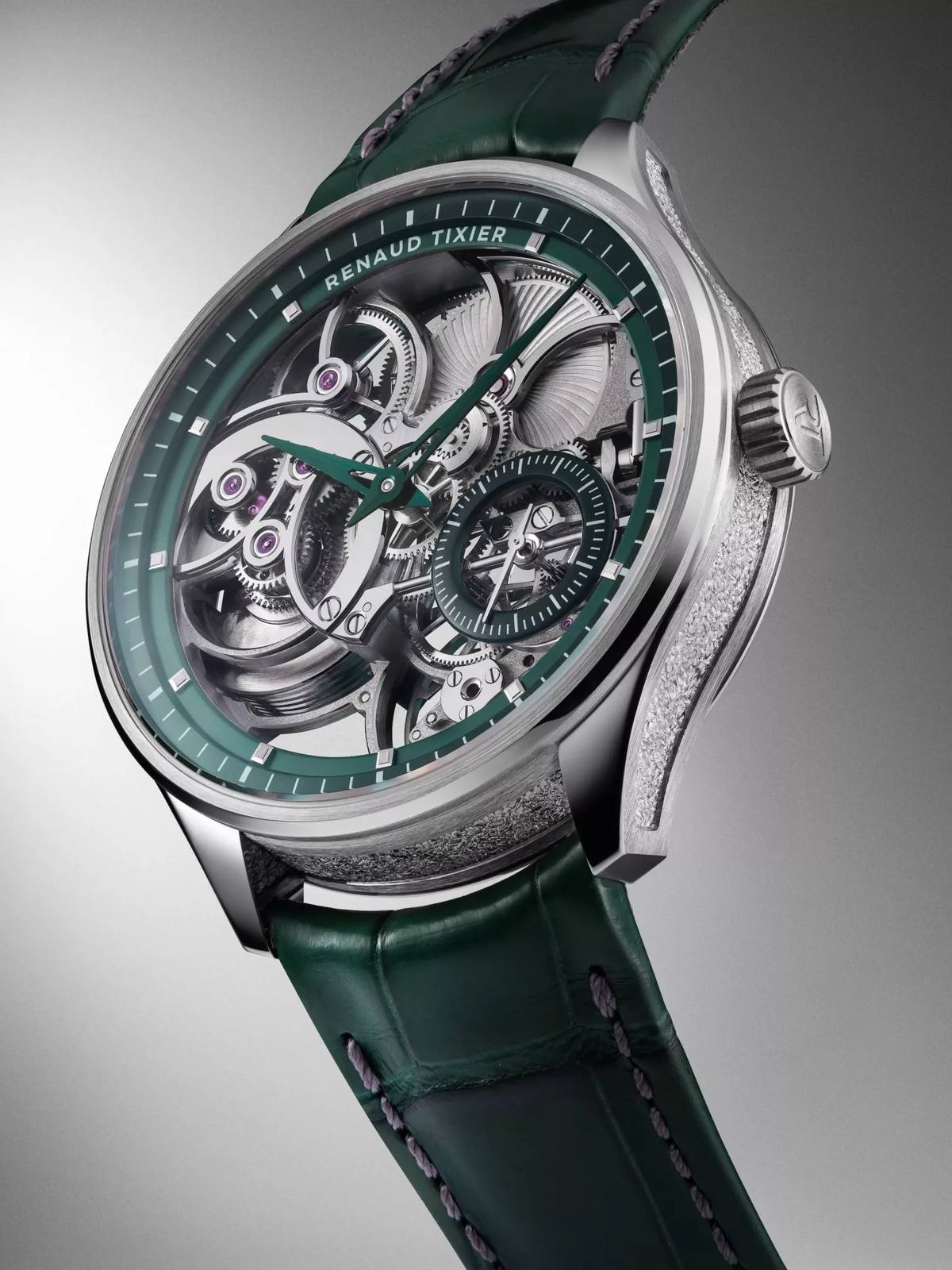 Renaud Tixier Monday Skeleton green edition at an angle showing openworked movement and engraved caseband.