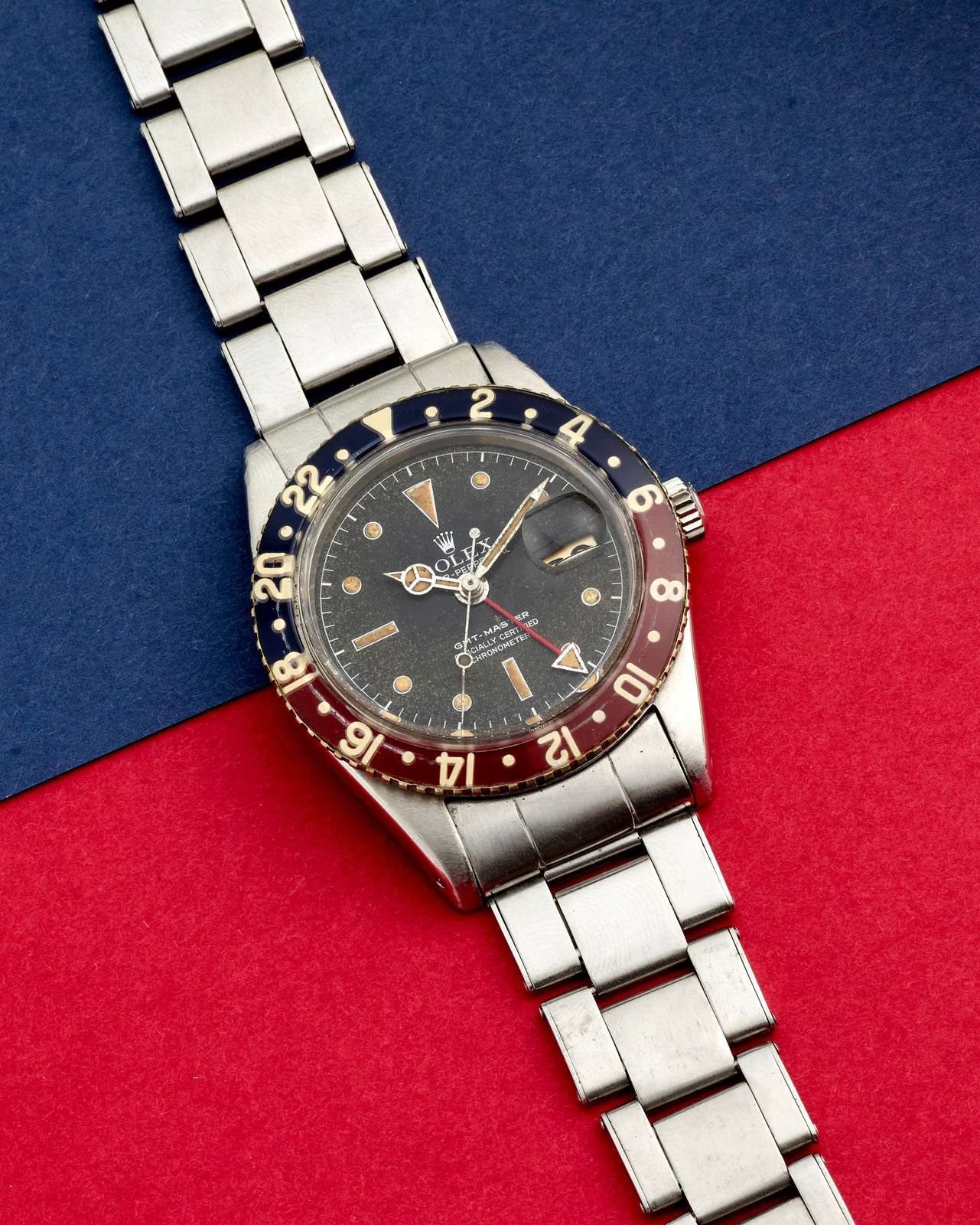 Rolex GMT-Master ref. 6542 in steel with original red and blue Bakelite bezel and riveted Oyster bracelet, front view